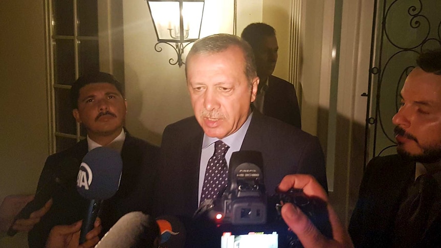 Turkish President Tayyip Erdogan speaks to media during an attempted military overthrow.