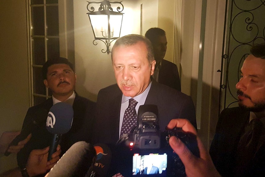 Turkish President Tayyip Erdogan speaks to media during an attempted military overthrow.