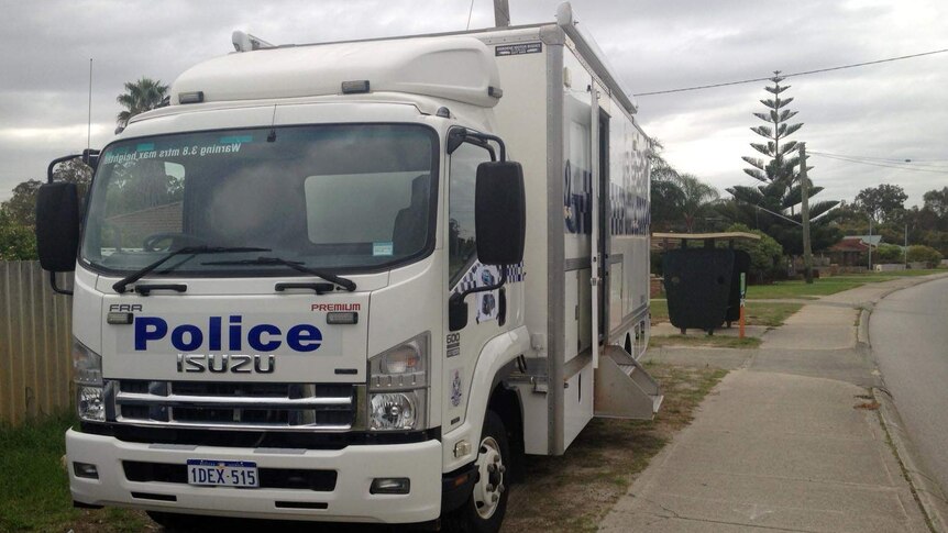 Police van on the Yangebup street where a mother was seen with her baby who later died.