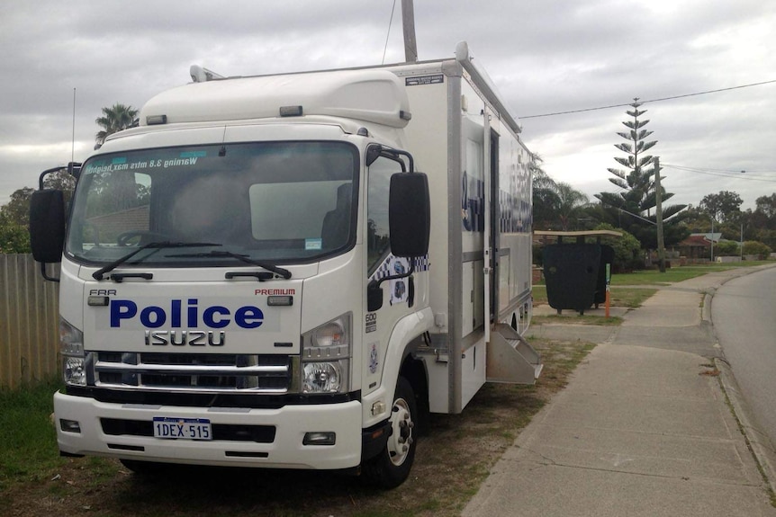 Police van on the Yangebup street where a mother was seen with her baby who later died.