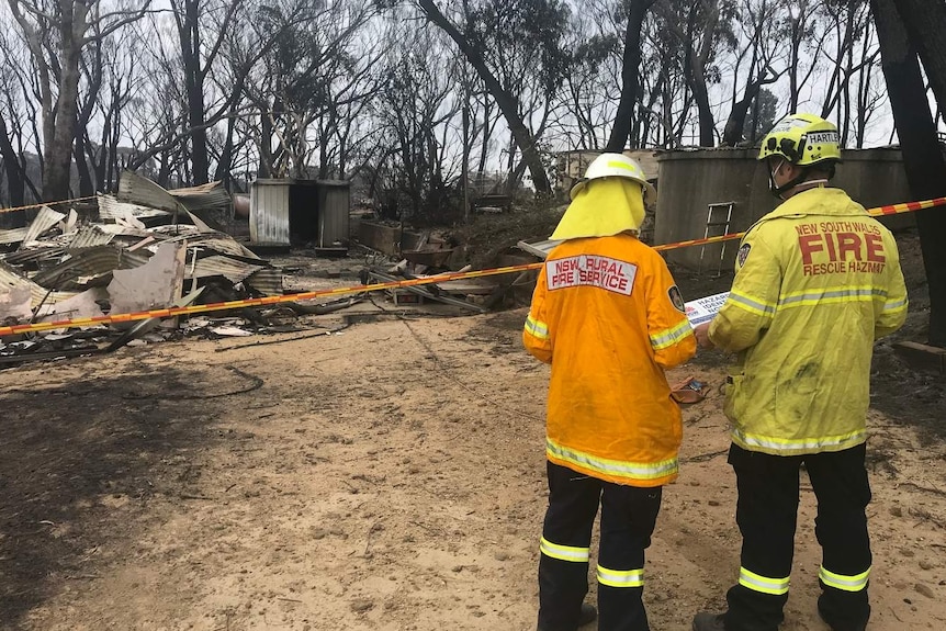 Assessment team at destroyed house