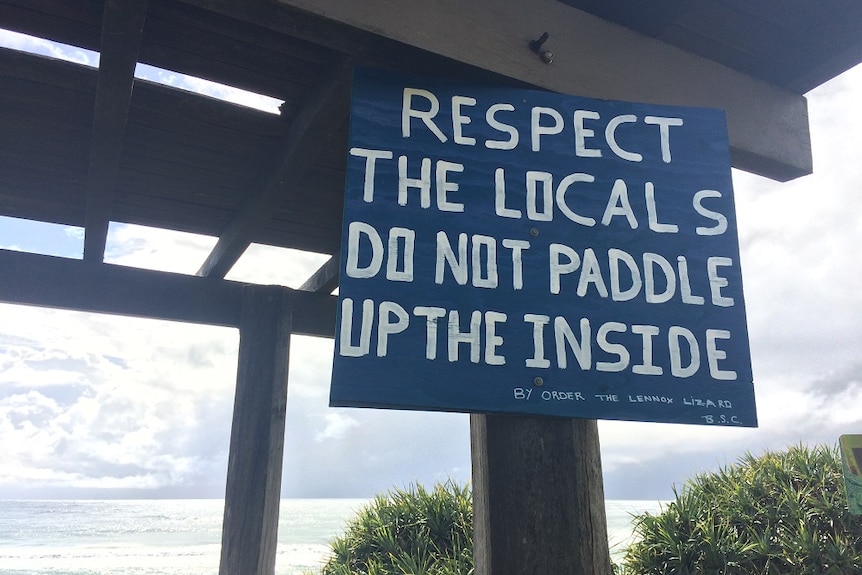 Sign saying "respect the locals, don't paddle up the inside' at Lennox Point.