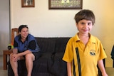 Tonya Murray with her daughter Jamae in the loungeroom of their Burketown home.
