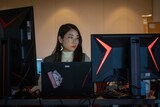 Kasumi "sumichu" Yogi sits behind PC screens at Awesome Games Done Quick 2019