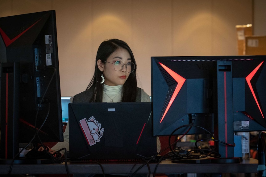 Kasumi "sumichu" Yogi sits behind PC screens at Awesome Games Done Quick 2019