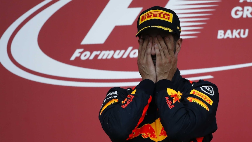 Daniel Ricciardo celebrates his victory at the Azerbaijan Grand Prix on the podium in Baku.