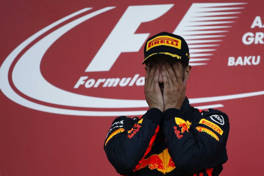 Daniel Ricciardo celebrates his victory at the Azerbaijan Grand Prix on the podium in Baku.