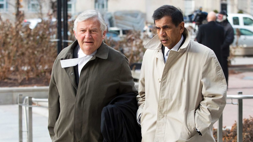 George Doodnaught walks with lawyer outside Toronto courthouse