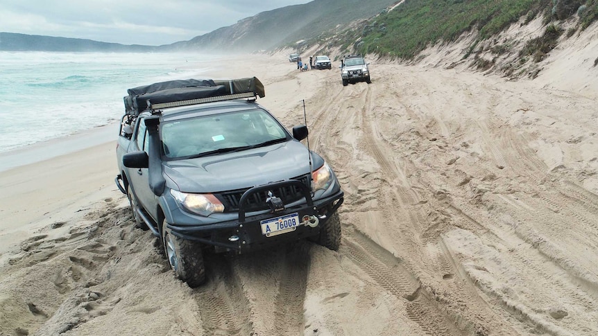 A four-wheel drive vehicle bogged in sand on Bornholm Beach