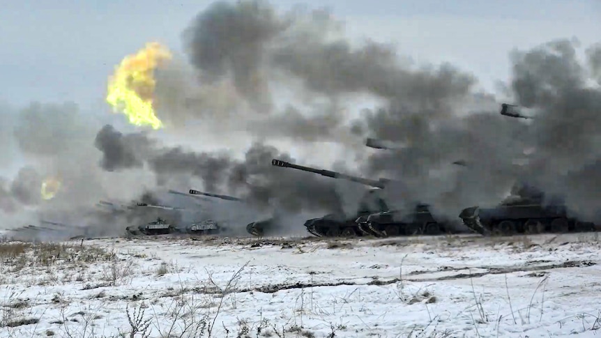 Heavy artillery weapons being fired in a wintry landscape