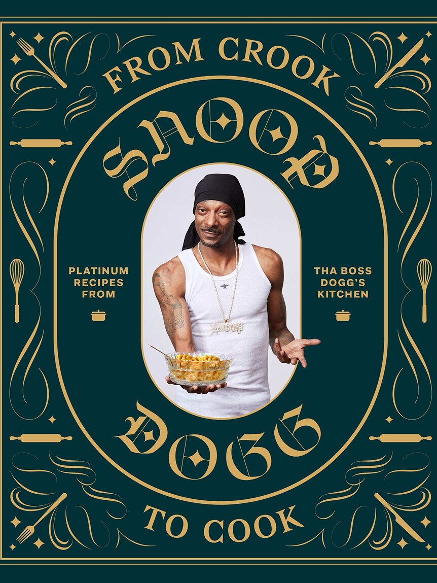 Snoop Dogg poses with a bowl of food on the front of a green embossed cookbook.