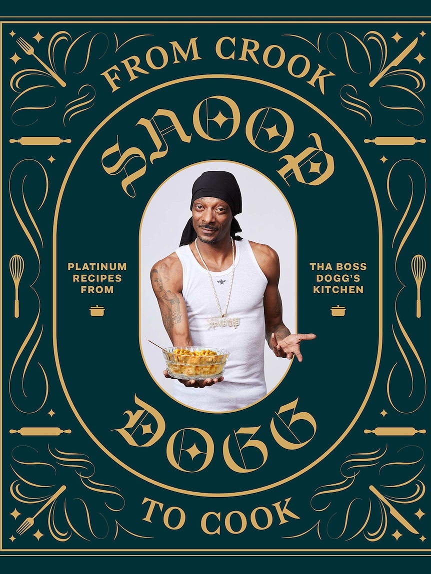 Snoop Dogg poses with a bowl of food on the front of a green embossed cookbook.