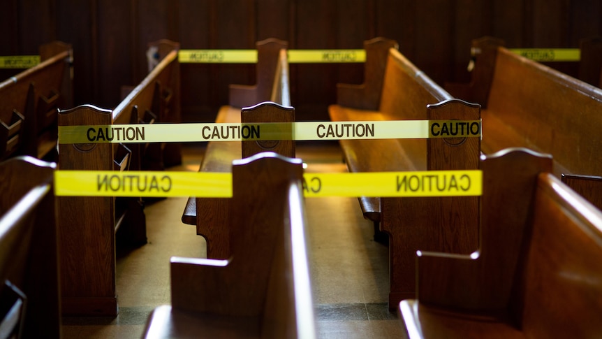 caution tape on church pews