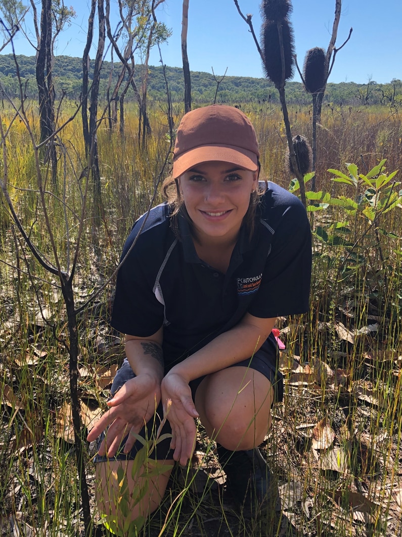 Matilda Davis in the filed with young paperbark with myrtle rust