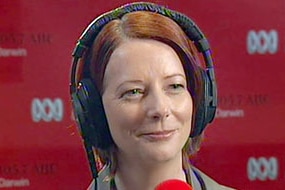 Julia Gillard listens to questions during an ABC radio interview in Darwin