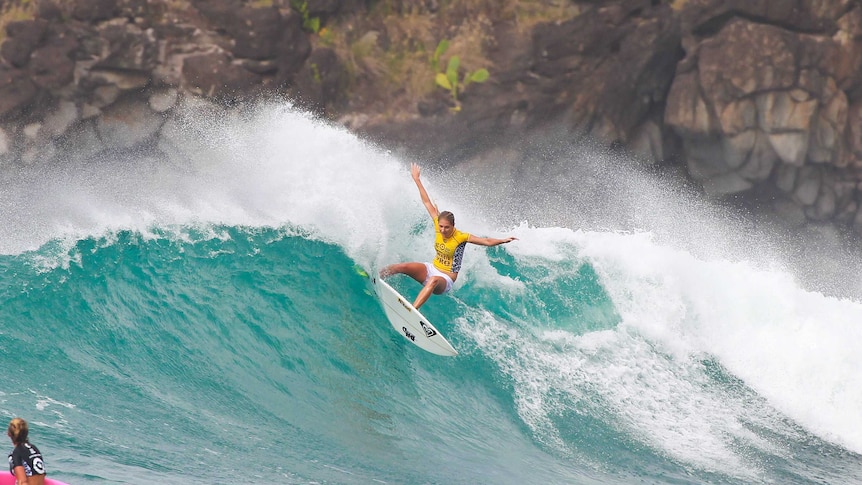 Australian surfer Stephanie Gilmore surfs a large wave