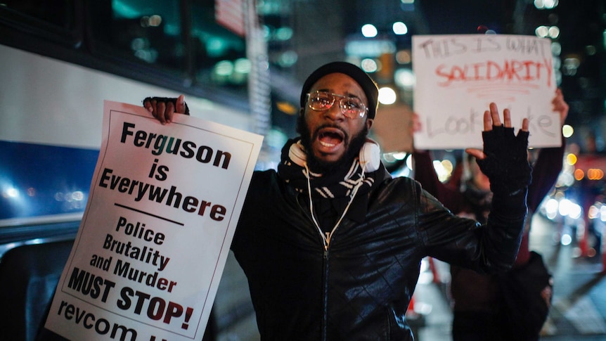 A man takes part during a protest in support of Eric Garner