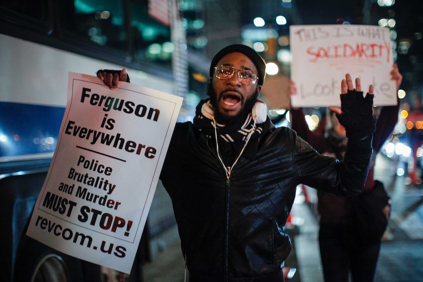 A man takes part during a protest in support of Eric Garner