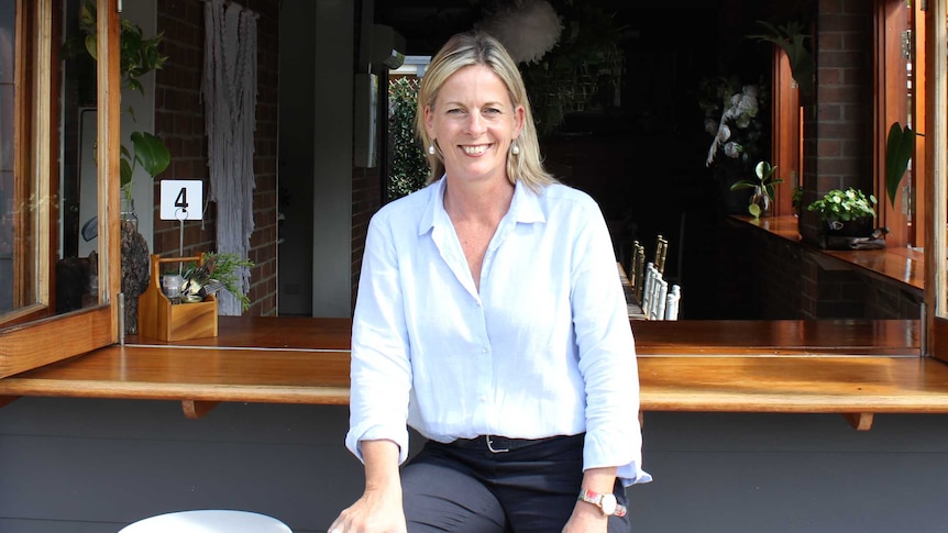 Angie Bell sits at a Highland Park cafe, during a day of Federal election campaigning.