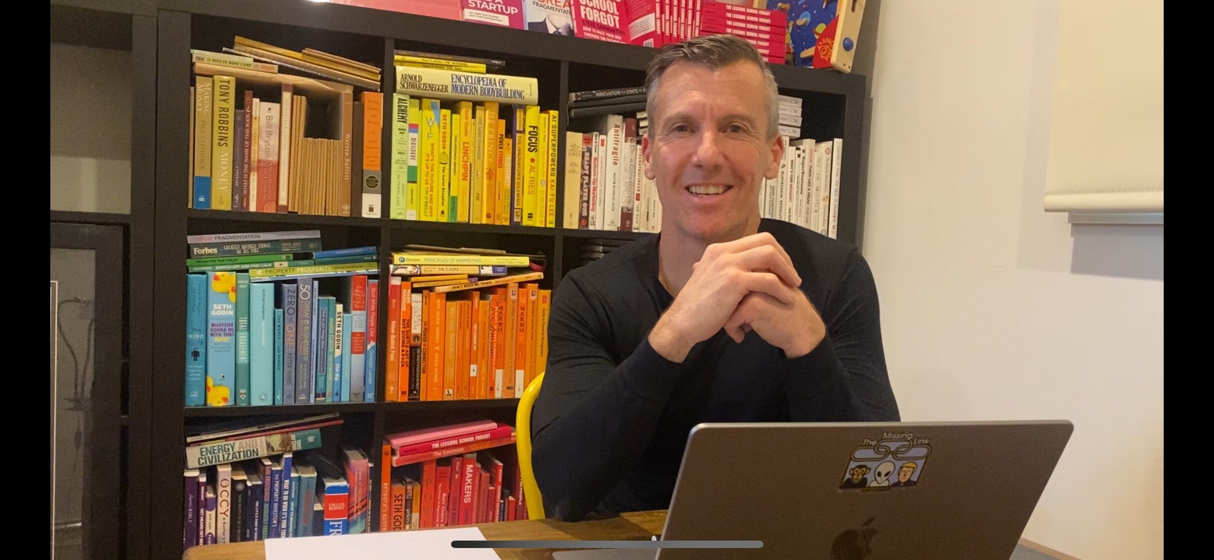 Steve Sammartino is sitting at his desk. 