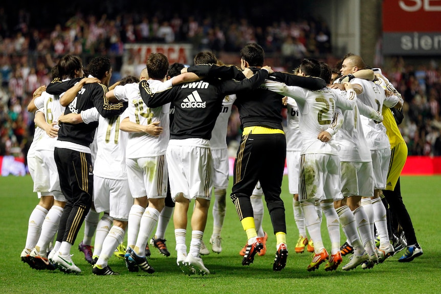 Real Madrid players celebrate first title since 2008.