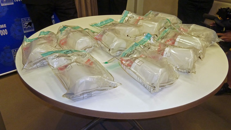 Police display the drugs that were found in the raids