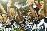 Melbourne Victory celebrate with A-League trophy