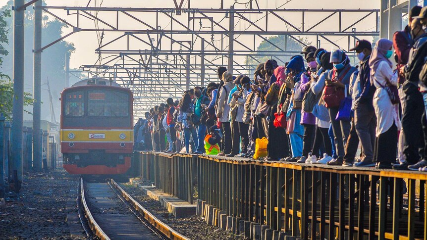 A very crowded train platform in Jakarta