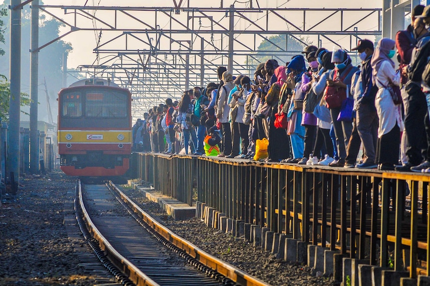 A very crowded train platform in Jakarta