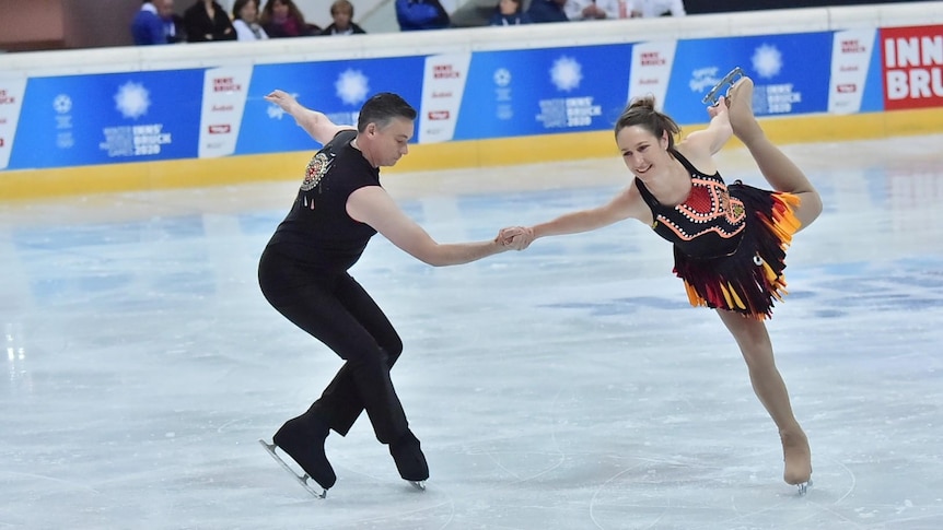 Robbie Bayliss and Julie Kernich-Curugliano holding a figure skating move.