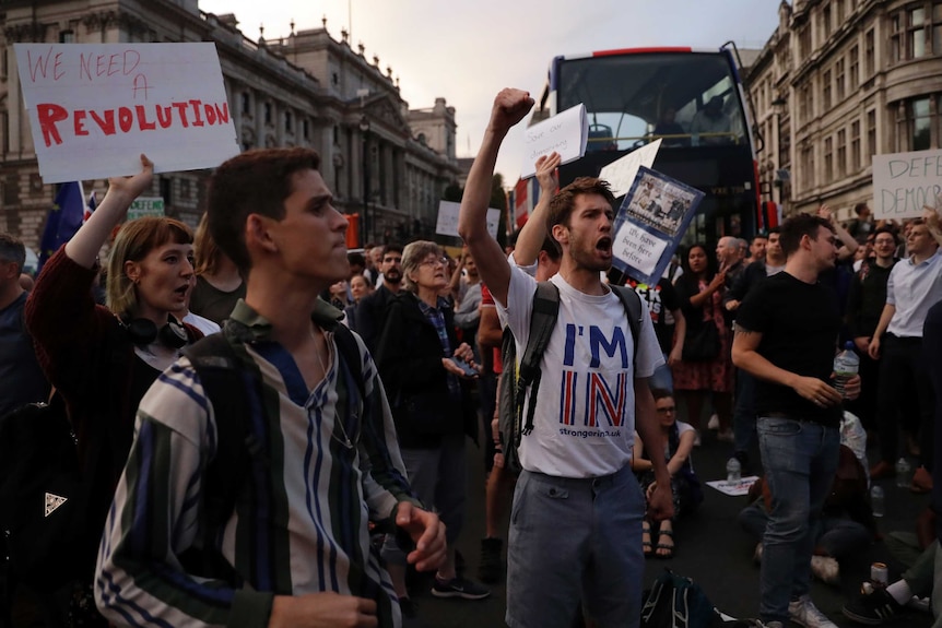 Anti-Brexit supporters gather outside the Prime Minister's residence, they appear to have blocked traffic.