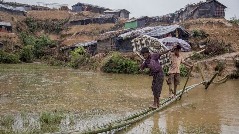 Children in Rohingya refugee camp cross the river.