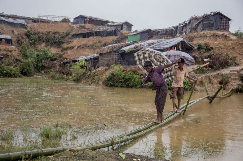 Children in Rohingya refugee camp cross the river.