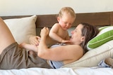 Alexandra Collier with her baby son on the couch