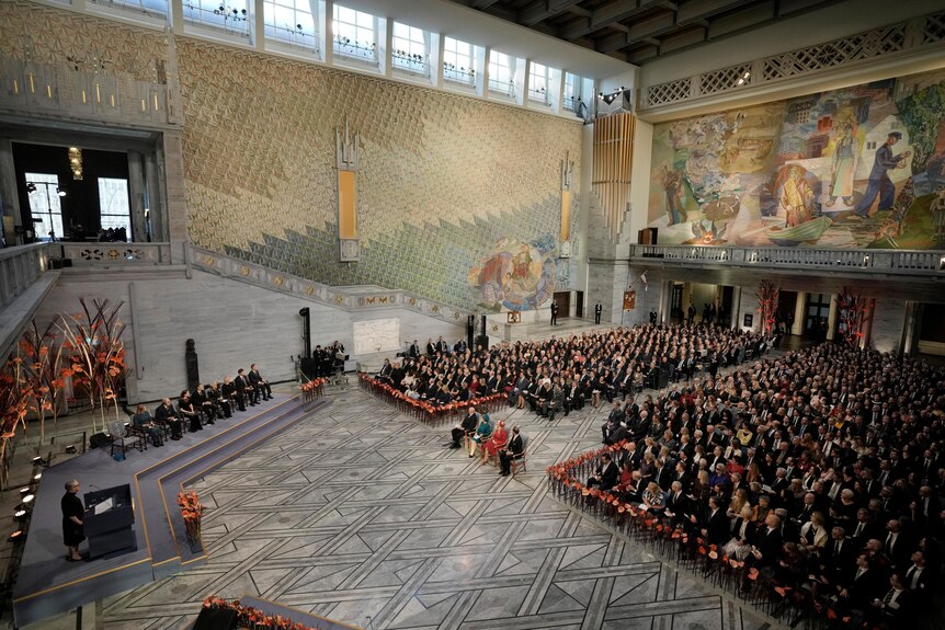 An overview of the Nobel Peace Prize ceremony at Oslo City Hall.