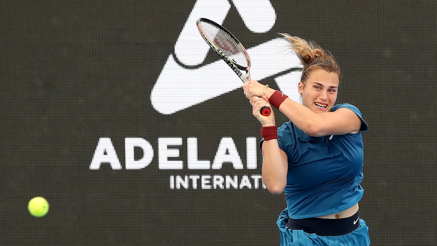 Aryna Sabalenka of Belarus in action against Rebecca Peterson of Sweden during day three of the 2022 Adelaide International