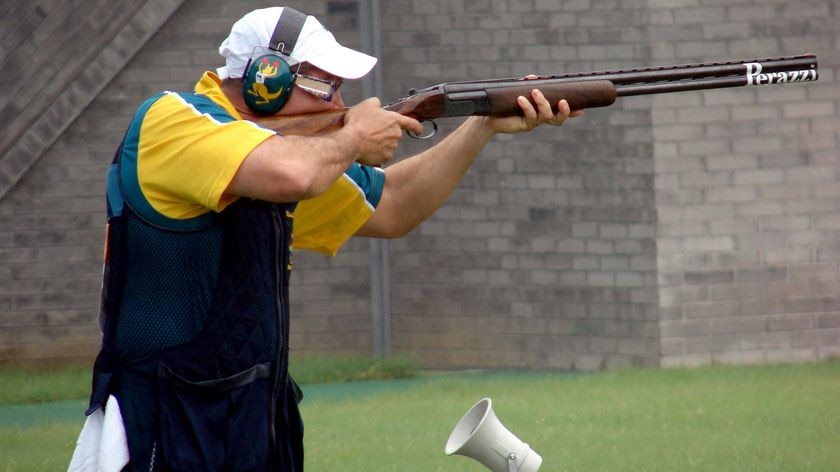 Michael Diamond takes aim during the bronze medal shoot-off