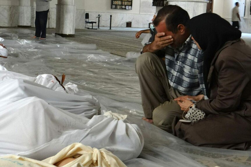 Syrian couple mourn victims