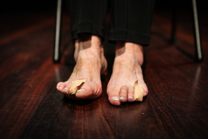 A close up of Inge's two bandaged bare feet.