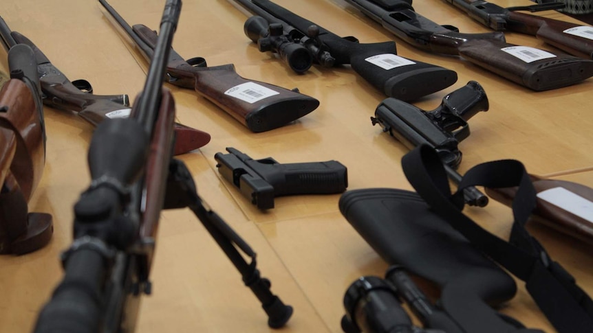 Rifles seized by police in the south west on a table.jpg