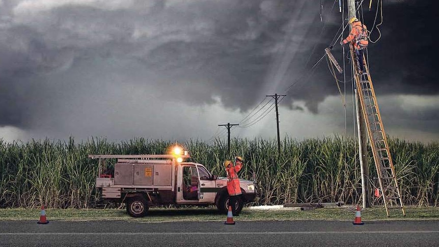 Essential Energy crew working on power network during storm