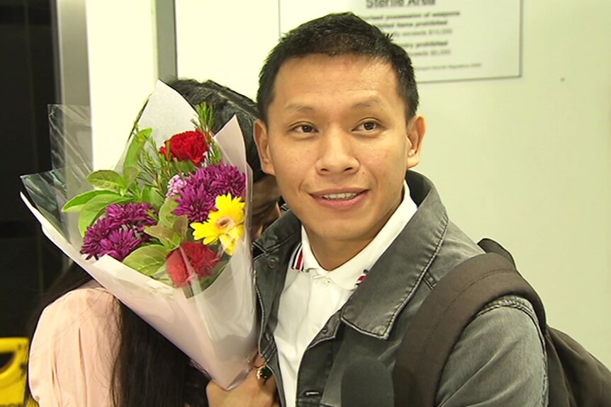 .Bijay Thapa hugs his wife at Brisbane Airport