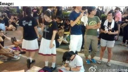 Hong Kong protest: Student does her homework while waiting for more protesters to arrive