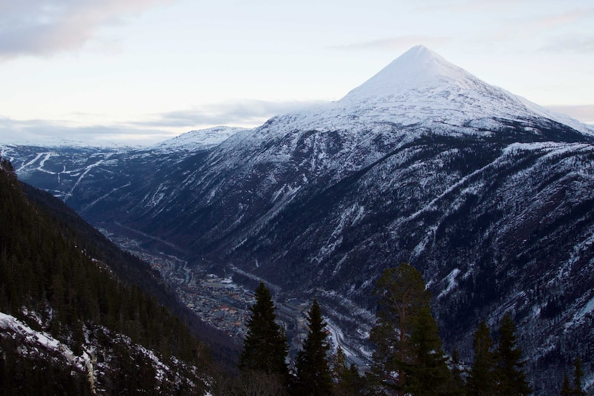 One of the towering Norwegian mountains, which is covered in snow, above Rjukan.