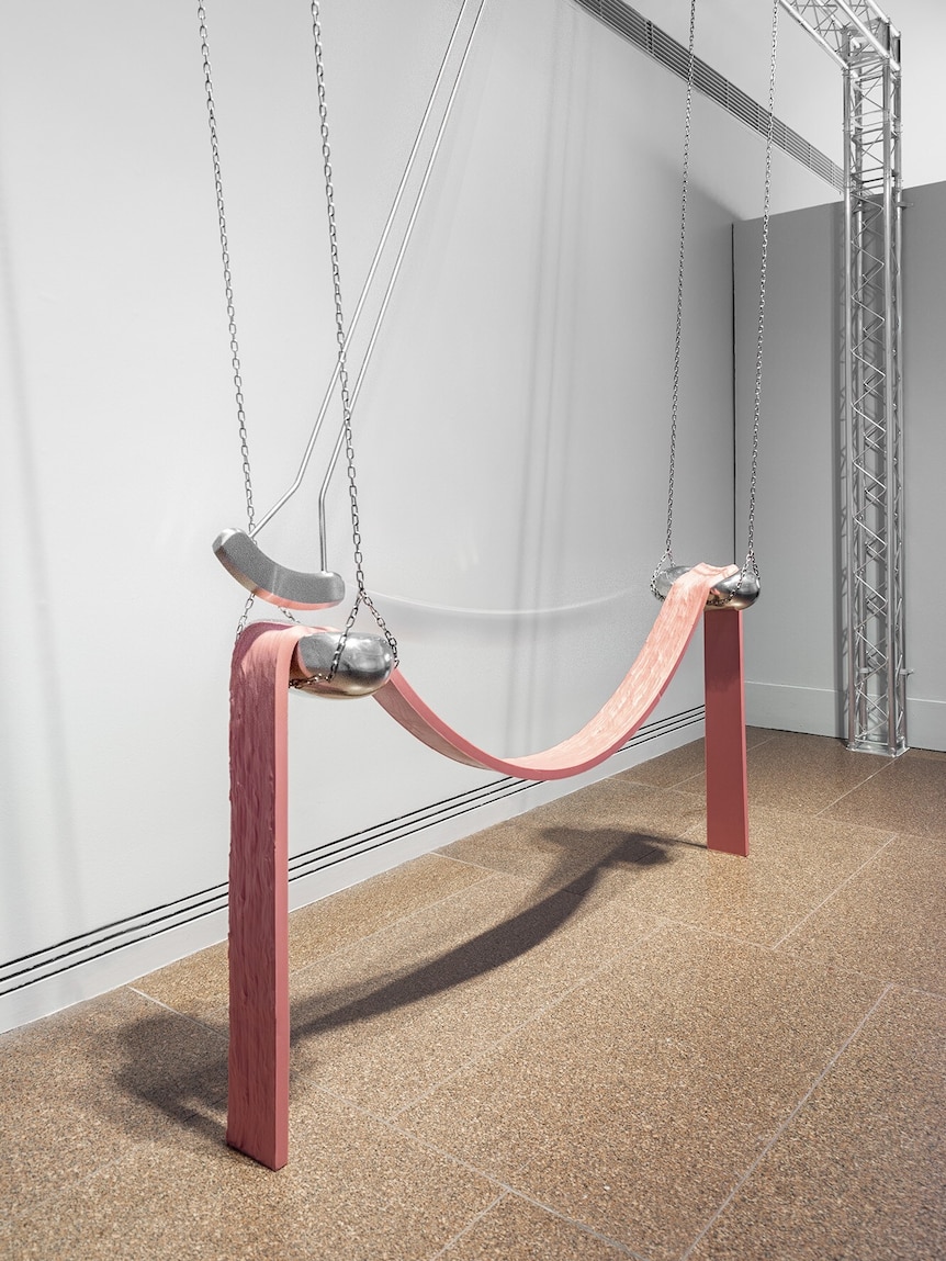 Kate Bohunnis's Ramsay Art Prize entry Edges of Excess, a pendulum sculpture, which swings over a slumped pink silicone form