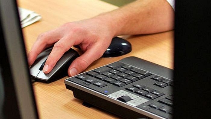 Computer mouse sits on a desk