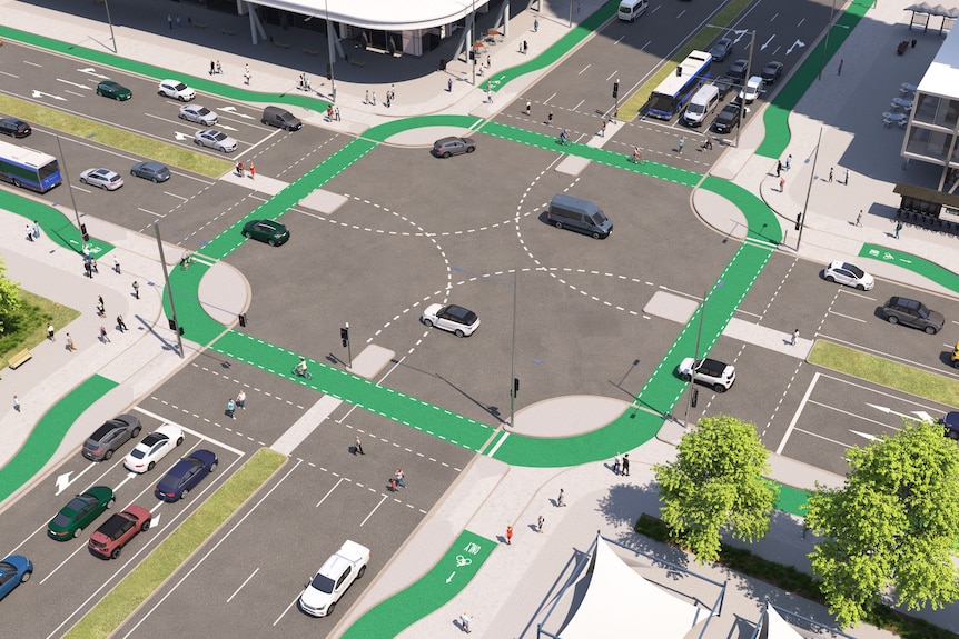 A graphic showing a proposed road intersection, with green lines on the road for cylists.