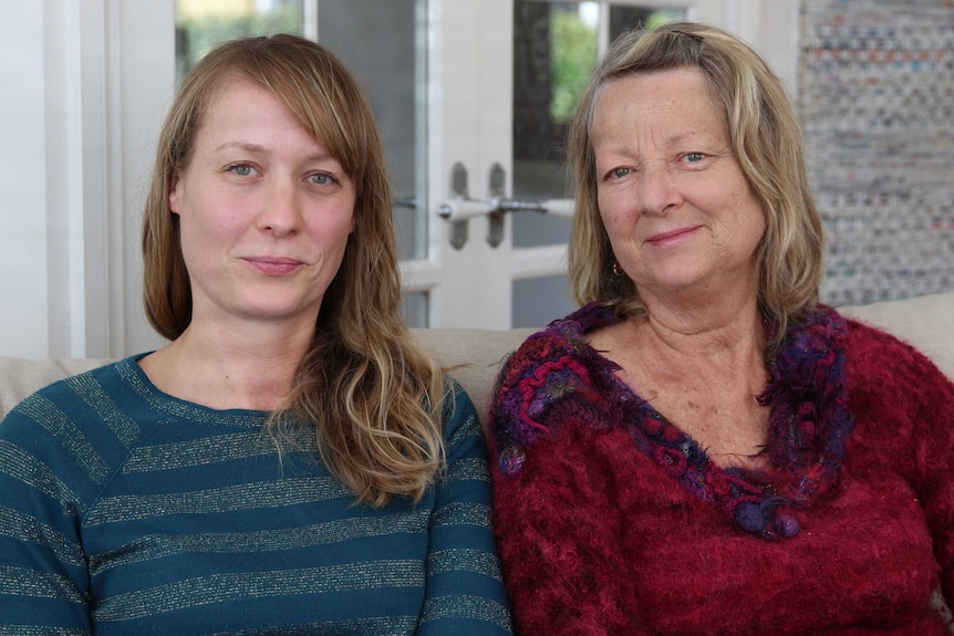 Sue McCuaig and her daughter Shelley McCuaig sitting next to each other on a couch, Hobart, Tasmania April 2020.