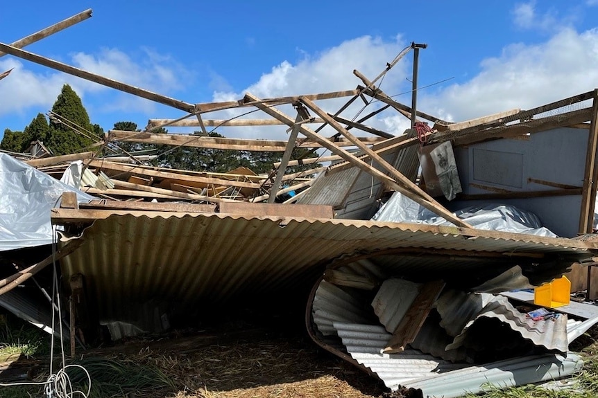 A pile of debris including corrugated iron.