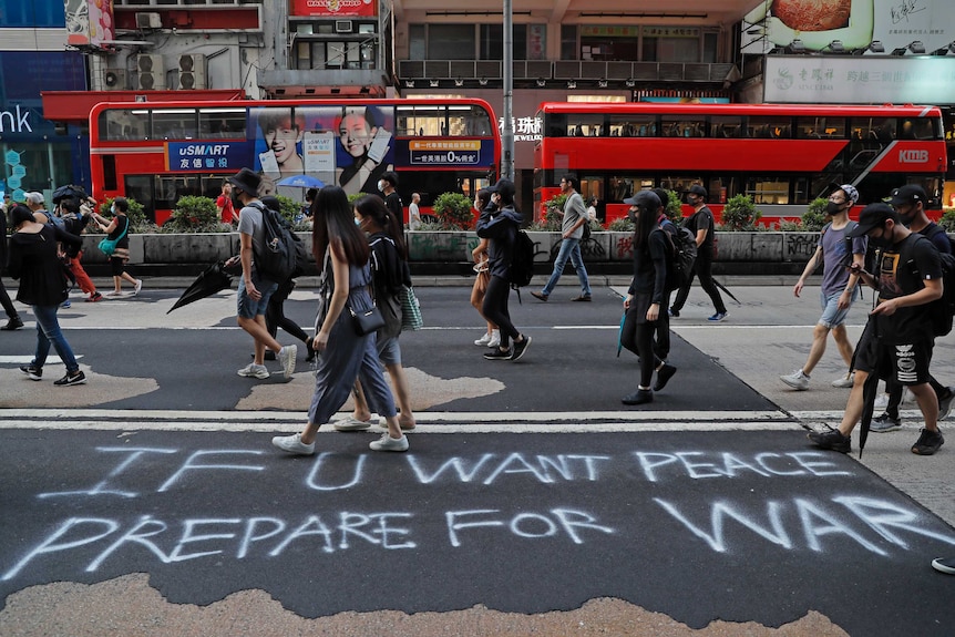 Graffiti on Hong Kong street reads "If U want peace prepare for war".